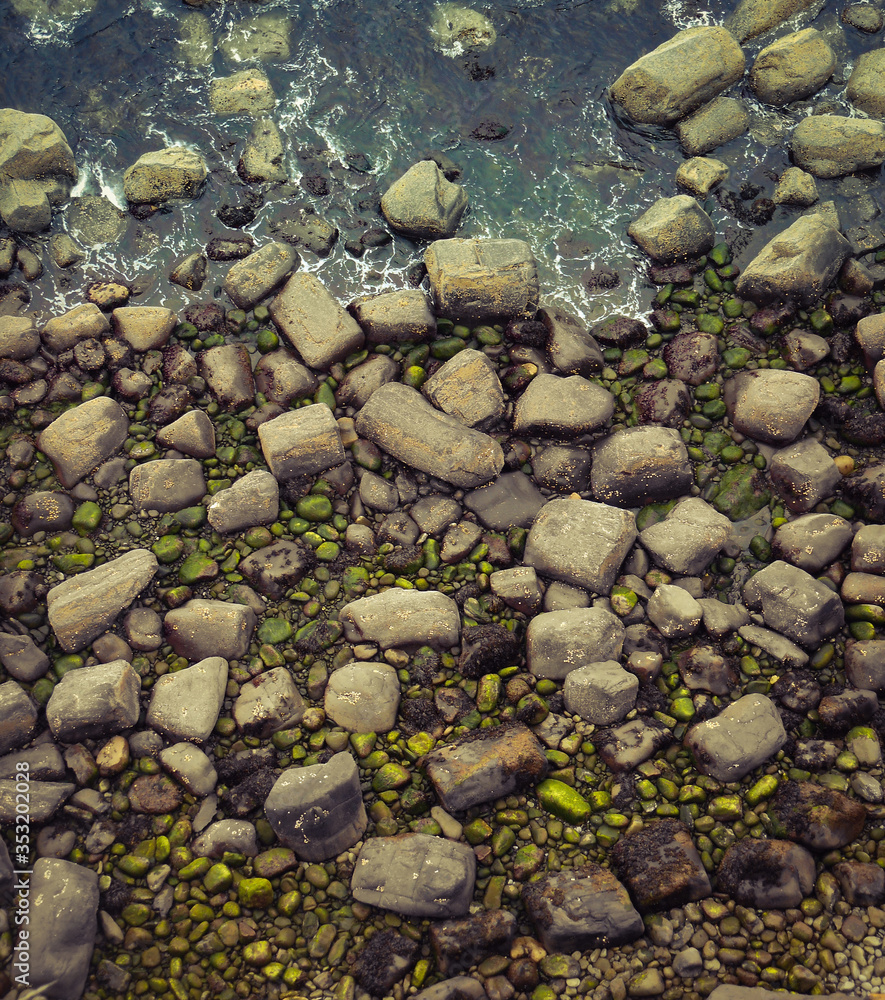 Close up of shoreline with water and rocks Close up of shoreline with water and rocks