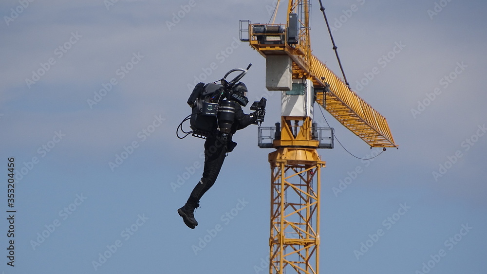 Jump Packing in front of a Crane Jump Packing in front of a Crane