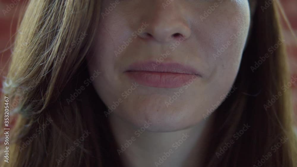 Close-up portrait of inspired caucasian lady with trendy make-up spending vacation. smiling shy girl with light-brown hair walking around city in morning. Close-up portrait of inspired caucasian lady with trendy make-up spending vacation. smiling shy girl with light-brown hair walking around city in morning.