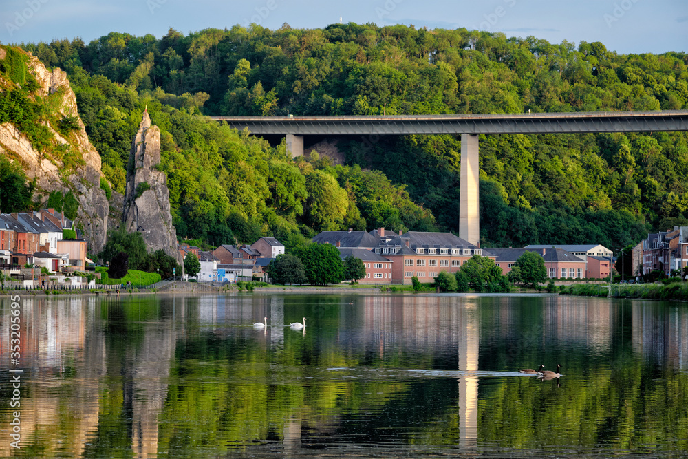 View of picturesque Dinant city over the Meuse river Dinant is a Walloon city and municipality located on the River Meuse, in the Belgian province of Namur on sunset with Bayard Rock and highway View of picturesque Dinant city over the Meuse river Dinant is a Walloon city and municipality located on the River Meuse, in the Belgian province of Namur on sunset with Bayard Rock and highway