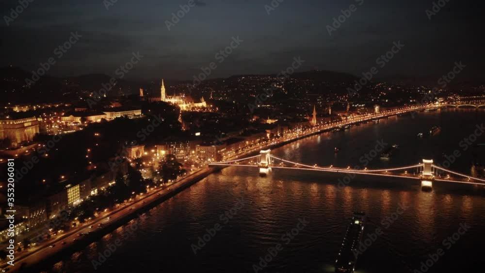 Budapest Hungary Aerial Rising Pulling Back Over the Danube River at Night Budapest Hungary Aerial Rising Pulling Back Over the Danube River at Night