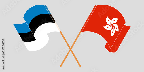 Crossed and waving flags of Hong Kong and Estonia
