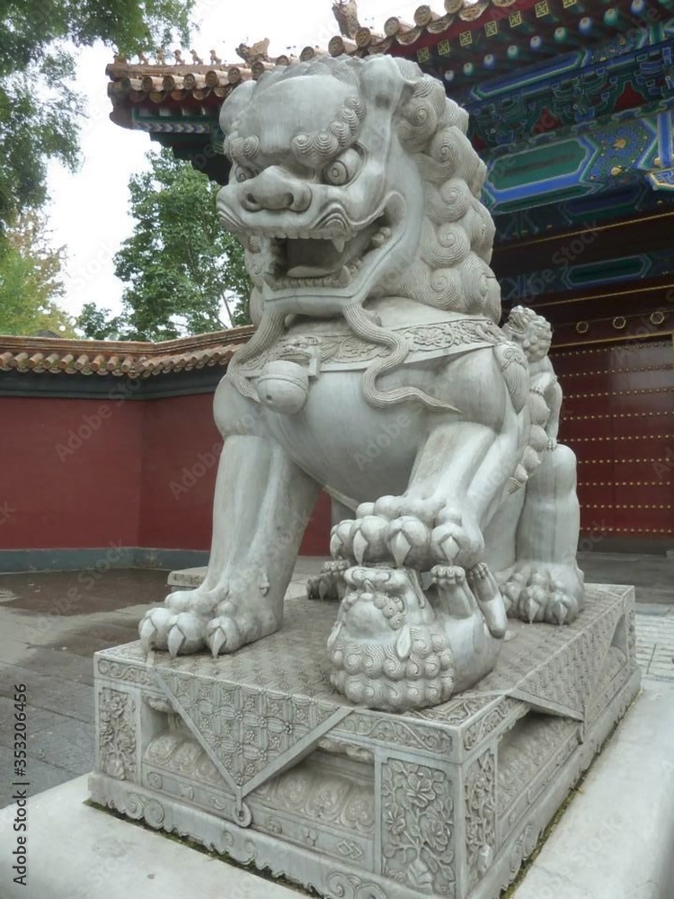 a lion sculpture made of stone