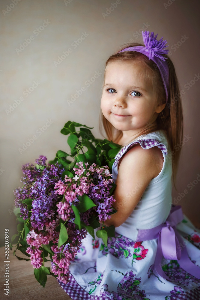 baby girl with a bouquet of lilac on a clear background, portrait, spring, may baby girl with a bouquet of lilac on a clear background, portrait, spring, may