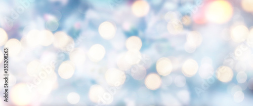 Spring Bokeh light background. Holiday glowing backdrop. Defocused Background