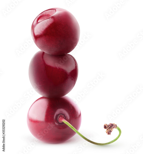 Isolated cherries pyramid. Fresh sweet cherry fruits on top of each other isolated on white background
