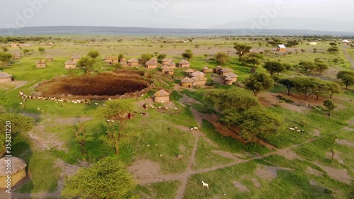 Aerial Drone Shot. Traditional Masai village at Sunset time near Arusha, Tanzania. photo