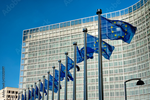 European EU flags in front of the Berlaymont building, headquarters of the European commission in Brussels photo