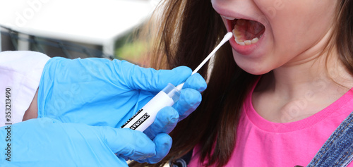 swab for the detection of the corona virus on the mouth of the l