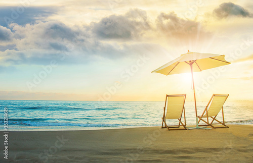 Background with couple of deck chairs at sunset, Travel concept, Summer background