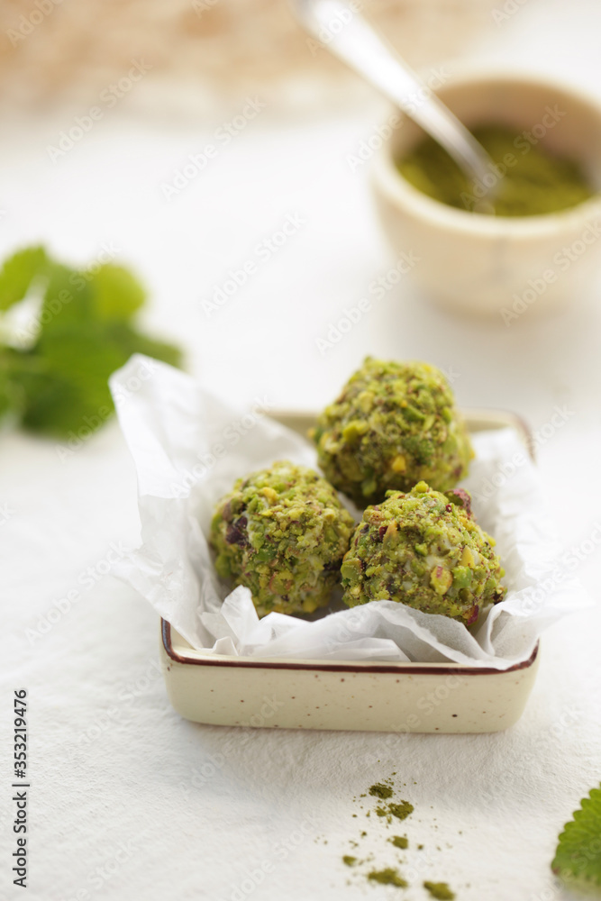 On a white background green candy from pistachios.
On a white background green candy from pistachios.