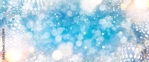 Christmas light background.  Holiday glowing backdrop. Defocused Background With Blinking Stars. Blurred Bokeh. © Vladimir