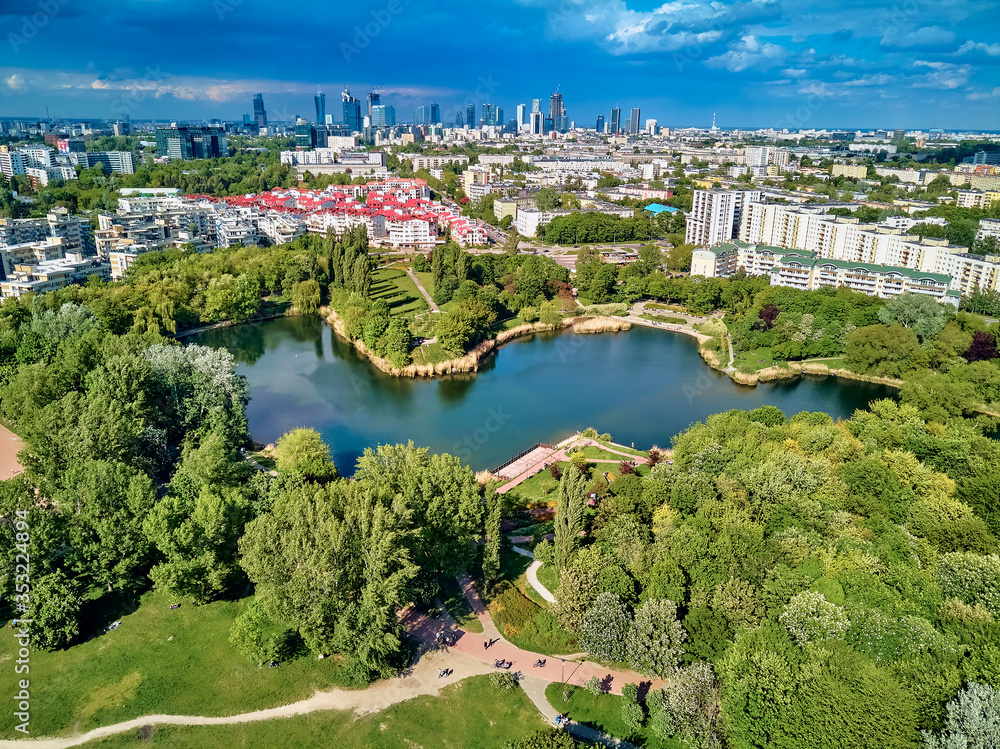 A beautiful panoramic view of the sunset in a fabulous evening on Szczesliwice Park - a former village, currently a housing estate in the Ochota district in Warsaw, Poland