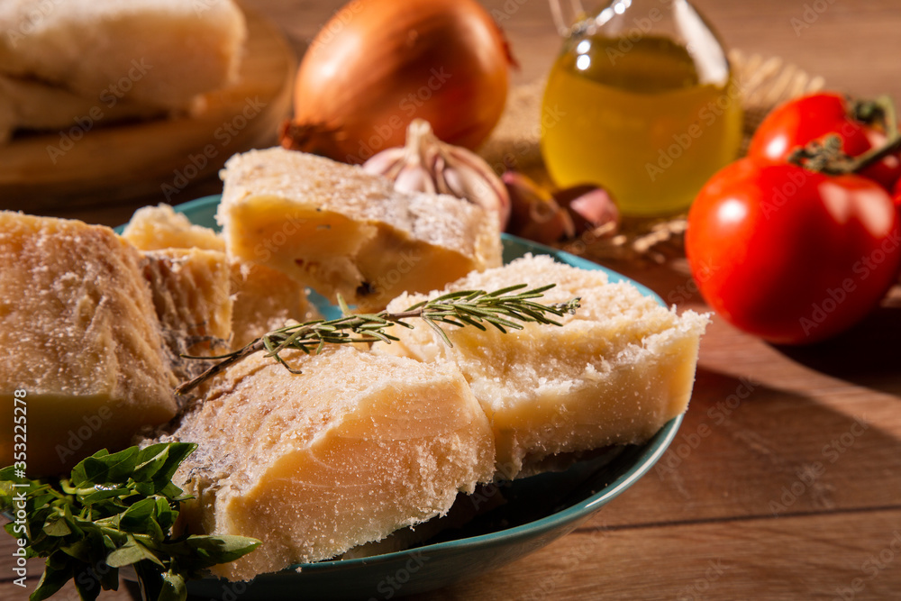 salted codfish on the wooden table with ingredients. Codfish raw.