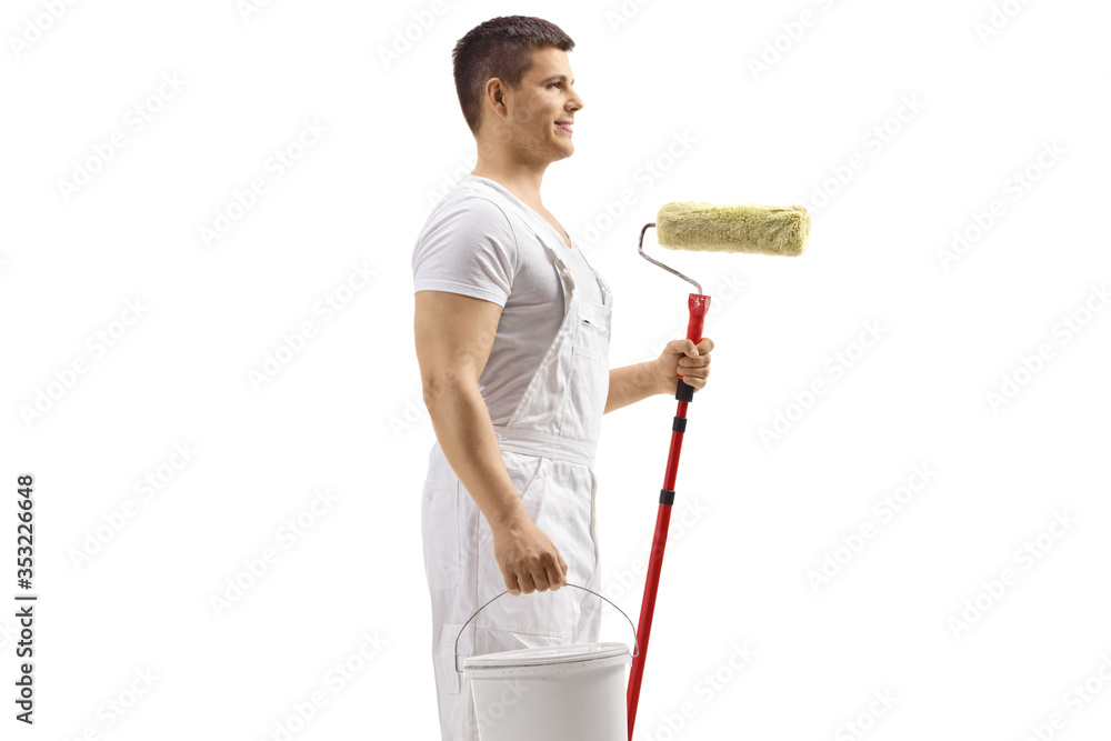 Painter holding a bucket and a paint roller Painter holding a bucket and a paint roller