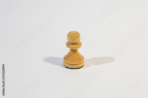 Chess pawn on the white background. 