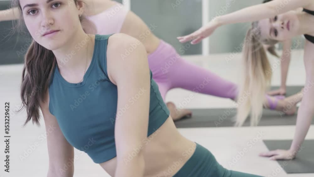 Yoga class People practicing yoga Side Angle Pose Yoga class People practicing yoga Side Angle Pose