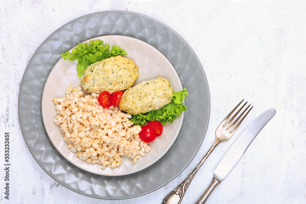 Chicken cutlets with oatmeal porridge. Concept of healthy food. Copy of the space.