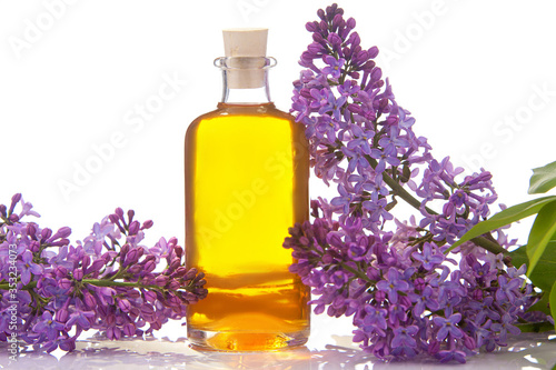 Essence of flowers on White background in beautiful glass jar