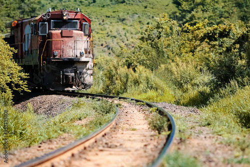 Paisagem exuberante de trilhos com trem em meio a vegetação da região de Botucatu, SP, Brasil photo