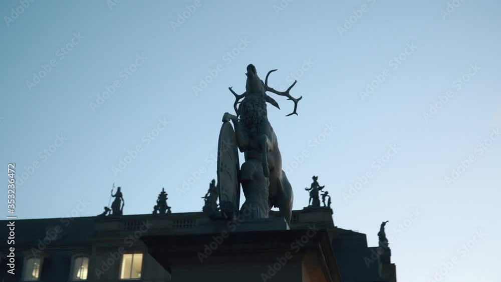 A statue of a deer on a castle square in Stuttgart, Germany. November 25, 2017. 4k video. Evening day A statue of a deer on a castle square in Stuttgart, Germany. November 25, 2017. 4k video. Evening day