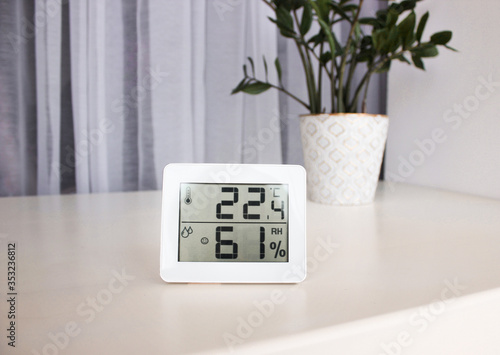 Photos Thermometer hygrometer measuring the optimum temperature and humidity in a house