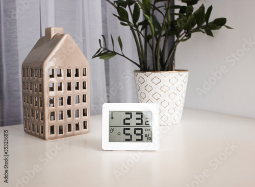 Thermometer-hygrometer measuring the temperature and humidity in the house, for a child.  The microclimate in the house, the relief of the disease, bronchi, cough, pneumonia isolation. photo