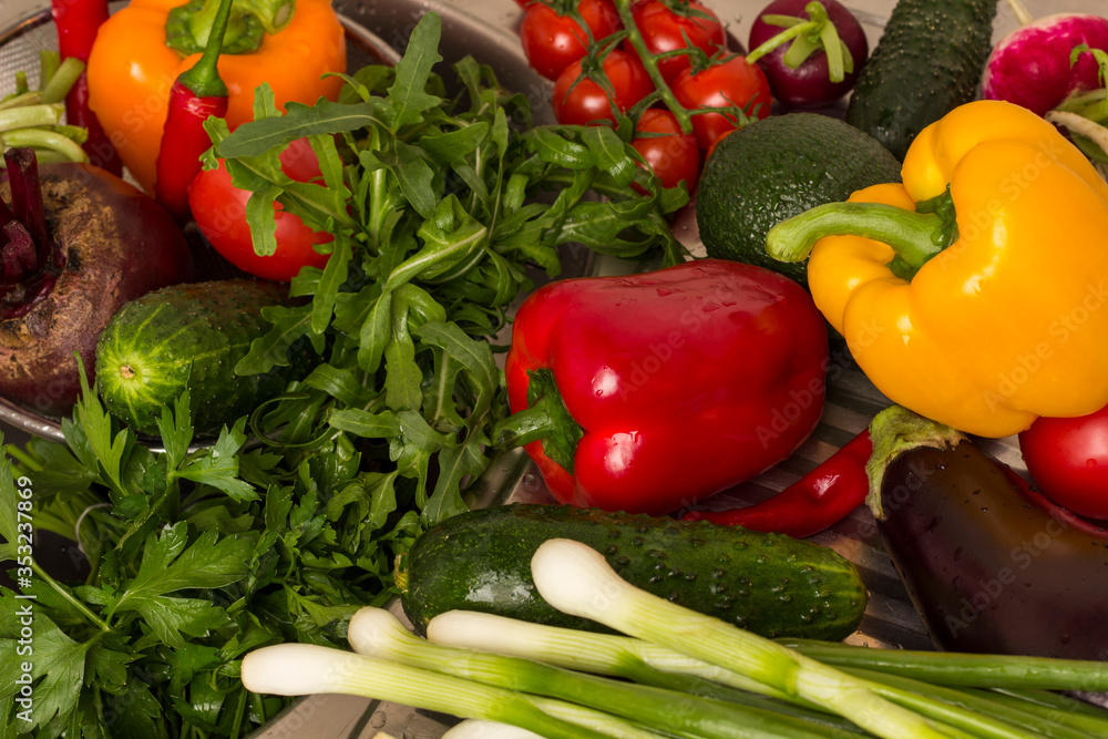 Set of multi-colored vegetables, arugula and green onions. Vegan food concept. Set of multi-colored vegetables, arugula and green onions. Vegan food concept.
