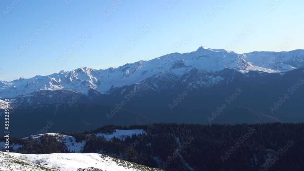 Snow-capped sopki. Alpine landscape. Snow-capped peaks. Blue sky and white snow. Far East. Snow-capped sopki. Alpine landscape. Snow-capped peaks. Blue sky and white snow. Far East.