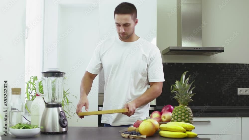 Man cut a Garnet to make the smoothie Man cut a Garnet to make the smoothie