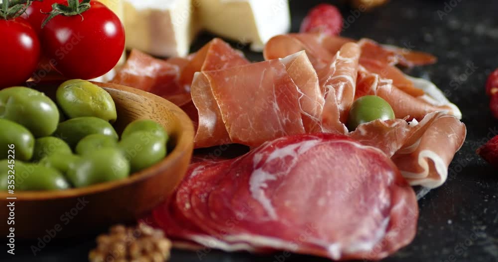 Antipasto of meats and vegetables slowly rotates. Antipasto of meats and vegetables slowly rotates.