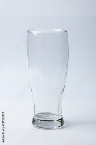 A empty glass against white background