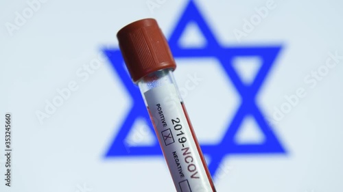 Corona virus or Covid-19 in Israel , sample blood tube with Israel flag on background