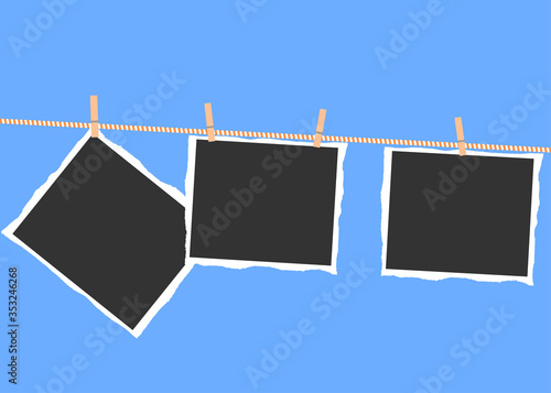 Torn photos hanging on a rope with clothespins on a blue background.