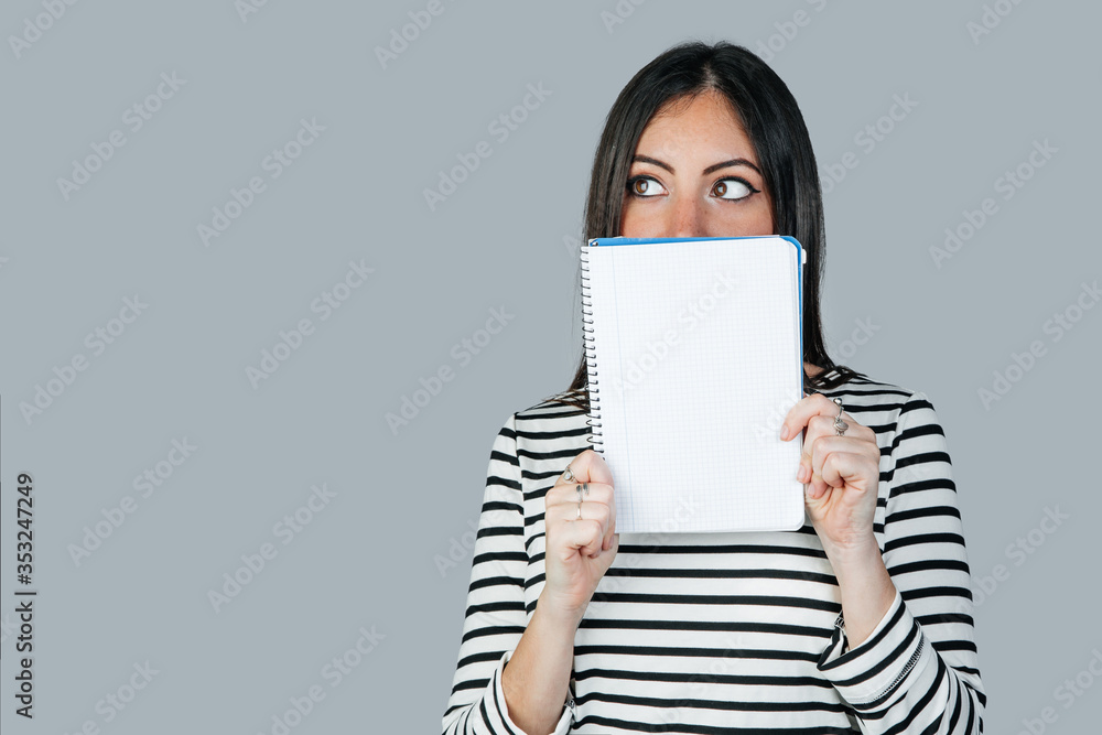 brunette white woman with a notebook with space to write. Mockup brunette white woman with a notebook with space to write. Mockup