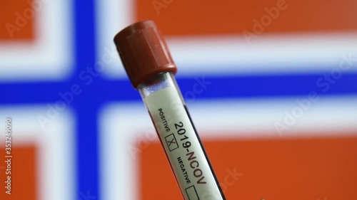 Corona virus or Covid-19 in Norway, sample blood tube with Norway flag on background