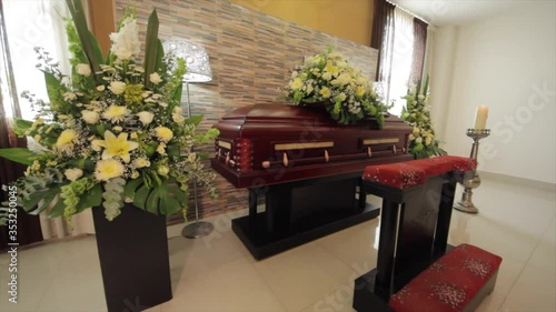 coffin with flowers in chapel