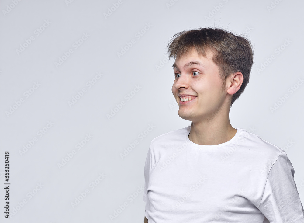 The young guy shows various emotions. Talented portrays the inner state and mood. Advertisement concept The young guy shows various emotions. Talented portrays the inner state and mood. Advertisement concept