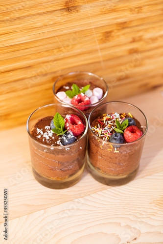 Group shot with glasses filled with chocolate mousse