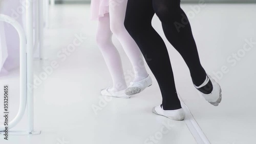 Wallpaper Mural Little ballet dancer repeats the movements with the teacher Torontodigital.ca