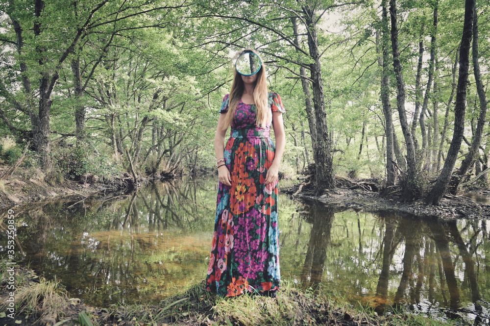 girl with a mirror instead of a face in the middle of pristine nature girl with a mirror instead of a face in the middle of pristine nature