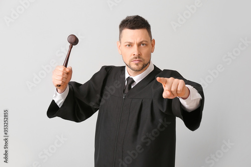 Strict male judge on light ...