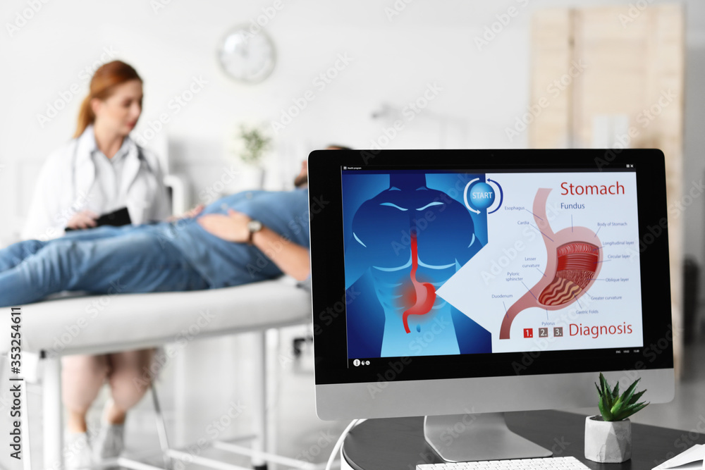 Modern computer on table in office of gastroenterologist Modern computer on table in office of gastroenterologist