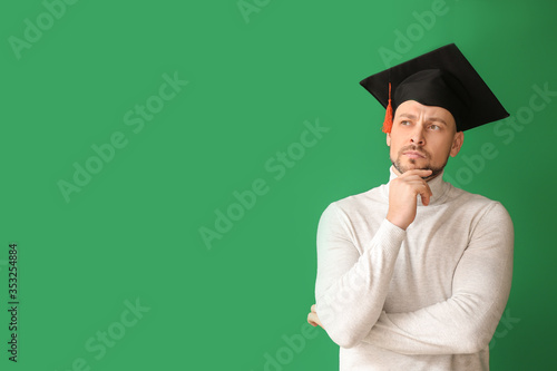 Thoughtful man in graduatio...