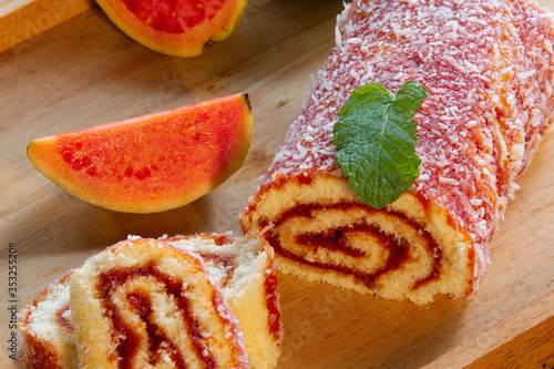 Bolo de Rolo (Swiss roll, Roll cake) typical Brazilian dessert, from the northeast region. Sliced ​​cake roll with guava paste.