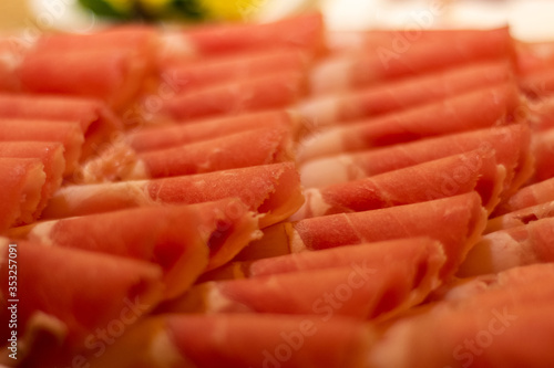 Thin slices of beef meat, ready to be cooked in hot pot, popular Chinese dish