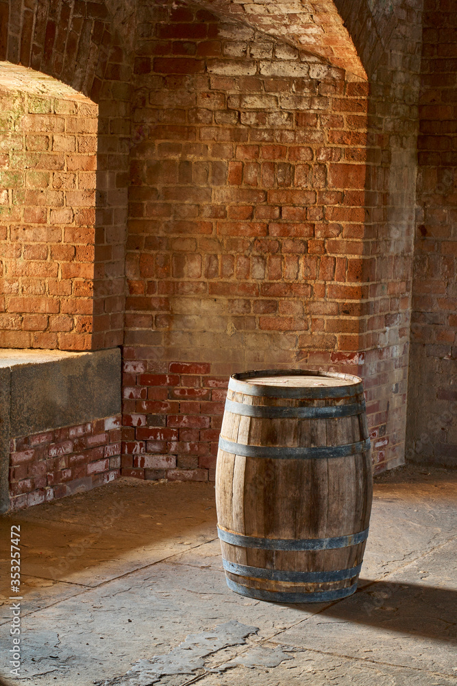 lone barrel set in a brick room next to a window lone barrel set in a brick room next to a window