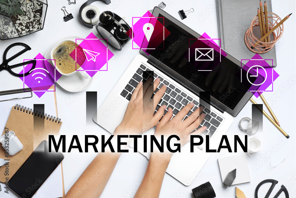 Digital marketing plan. Woman working with laptop at table, top view