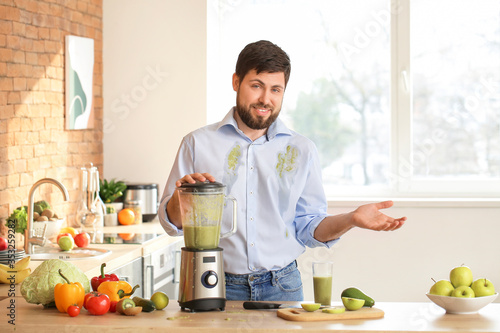 Clumsy man with spilled smo...