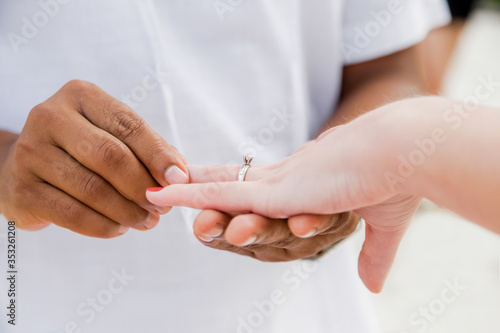 Engagement ring for romantic outdoor elopement marriage proposal when man proposing and holding up an engagement ring in box 